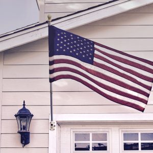 american-flag-hanging-on-a-home-on-july-4th-2026-03-19-23-14-08-utc