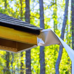 An exposed wood surface was exposed after hurricane blew off aluminum fascia trim