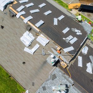 Roofer replace shingle that has been damaged and needing replacement