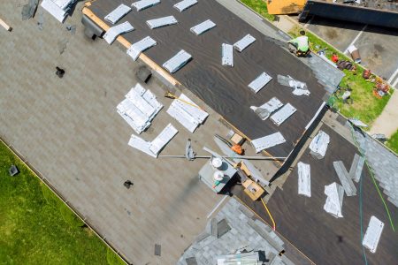 Roofer replace shingle that has been damaged and needing replacement