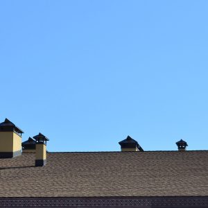 Modern roofing and decoration of chimneys. Flexible bitumen or slate shingles. The absence of corrosion and condensation due to the flexible roof